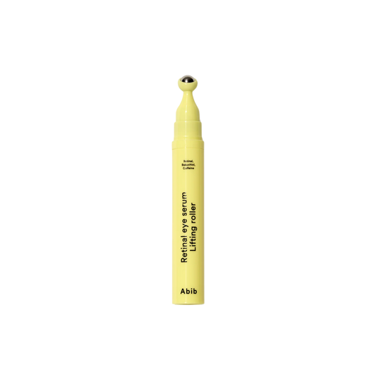 ABIB Retinal Eye Serum Lifting Roller is a lightweight eye treatment designed to help smooth fine lines, reduce puffiness, and improve the look of dark circles. Formulated with Retinal and Bakuchiol, it supports skin elasticity and helps refine texture for a firmer, more lifted appearance. Caffeine helps reduce puffiness and revitalize tired eyes, while Ceramide, Ectoin, and Collagen work to strengthen the skin barrier and maintain hydration. The cooling roller applicator enhances absorption and provides a 