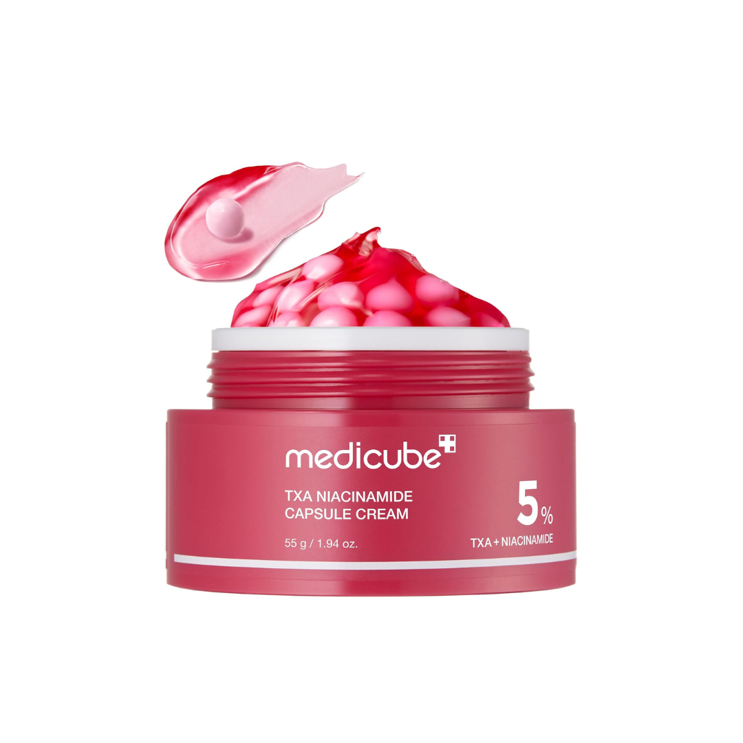 This tone-correcting capsule cream, MEDICUBE TXA Niacinamide Capsule Cream, is made to improve the look of uneven tone, dark spots, dullness, and rough texture while supporting a clearer, more radiant complexion. The lightweight capsule-gel texture lets you customize the mix of brightening capsules and hydrating gel based on your skin’s needs.

Formulated with Niacinamide, Tranexamic Acid, Glutathione, Alpha-Arbutin, Panthenol, Bisabolol, Ferulic Acid, Ceramide NP, Vitamin C derivative, and multiple types o