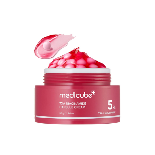 This tone-correcting capsule cream, MEDICUBE TXA Niacinamide Capsule Cream, is made to improve the look of uneven tone, dark spots, dullness, and rough texture while supporting a clearer, more radiant complexion. The lightweight capsule-gel texture lets you customize the mix of brightening capsules and hydrating gel based on your skin’s needs.

Formulated with Niacinamide, Tranexamic Acid, Glutathione, Alpha-Arbutin, Panthenol, Bisabolol, Ferulic Acid, Ceramide NP, Vitamin C derivative, and multiple types o