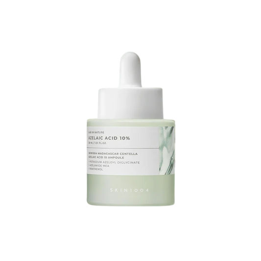 SKIN1004 Lab in Nature Madagascar Centella Azelaic Acid 10 Ampoule is a lightweight serum designed to help control excess sebum, improve moisture balance, and refine uneven skin tone and texture. Formulated with 10% Azelaic Acid, Azelamide MEA, Potassium Azeloyl Diglycinate, Centella Asiatica Extract, Panthenol, Hyaluronic Acid, Allantoin, Beta-Glucan, and Licorice Root Extract, it helps calm visible redness, support rosacea-prone skin, soothe blemish-prone skin, and promote smoother-looking skin. This non-