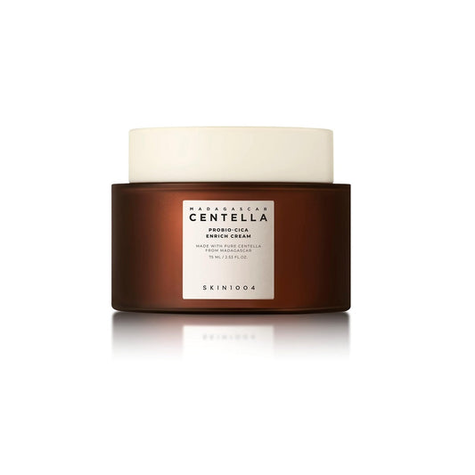 SKIN1004 Madagascar Centella Probio-Cica Enrich Cream is a nourishing moisturizer designed to strengthen and repair the skin barrier. Infused with Lactobacillus/Centella Asiatica Extract Ferment Filtrate and Centella Asiatica Extract, it soothes and calms irritated skin. Enriched with Ceramide NP and TECA, it helps lock in moisture and improve skin resilience, while Macadamia Seed Oil and Moringa Oil provide deep hydration and nourishment. Perfect for restoring balance and comfort to sensitive or dry skin.
